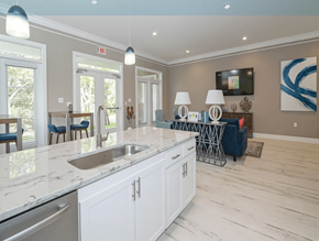 Wilmington apartment for rent - A modern kitchen with a marble countertop and white cabinets.