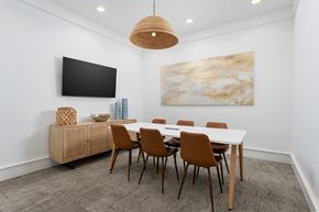 Oak Island apartment for rent - A modern dining room with a large table and chairs.