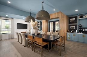 Ocean Isle Beach apartment for rent - A modern dining room with a black table and chairs.
