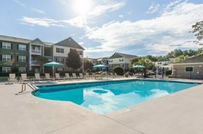 Wilmington apartment for rent - our apartments offer a swimming pool with our apartment building in the background