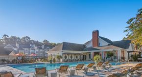 Myrtle Beach apartment for rent - A large clubhouse with a pool in front at Palmetto Pointe apartments in Myrtle Beach, SC.