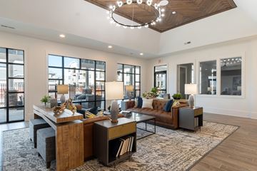 Fayetteville apartment for rent - a living room with couches and chairs and a table