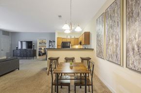 Macon apartment for rent - A dining room with a wooden table and chairs.