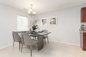 Fayetteville apartment for rent - A dining room with a table and chairs.