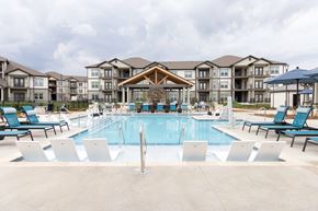 Hendersonville apartment for rent - A large swimming pool in front of apartment buildings at the Wilmont at Hendersonville Apartments in Hendersonville,NC