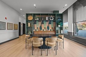 Deerfield apartment for rent - A modern dining room with a long table and chairs.