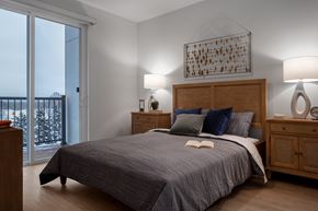 Wauwatosa apartment for rent - a bedroom with a bed and a window at 2929 on Mayfair, Wisconsin