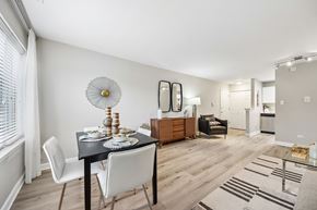 Palatine apartment for rent - A dining room with a table set for two and a white chair.