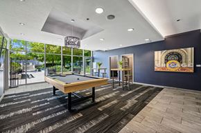 Chicago apartment for rent - a rec room with a pool table and a mural on the wall at Halsted Flats Apartments, Chicago, IL, 60613