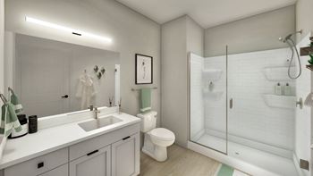 A bathroom with a shower toilet and sink