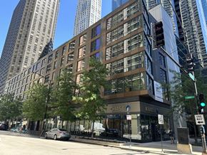 Chicago apartment for rent - a building on the corner of a street with a traffic light