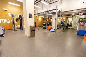 Chicago apartment for rent - a workout room with weights and other equipment in a gym at The Kent, Illinois
