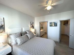 St Francis apartment for rent - a bedroom with a large bed and a ceiling fan at 42 Hundred On The Lake, St Francis