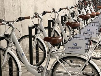 A row of bicycles are parked