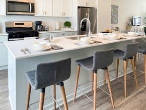 Crystal Lake townhouse for rent - a kitchen with a counter top and chairs