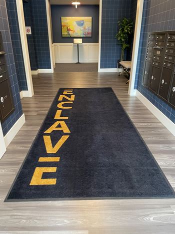 A navy rug on the floor of a locker room