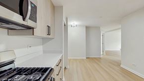 Libertyville apartment for rent - A kitchen with a stove, microwave, and oven.