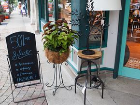 Libertyville apartment for rent - A sign outside a store advertises 50% off.