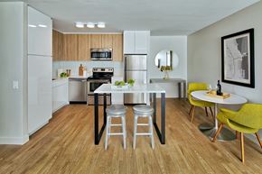 Chicago apartment for rent - a kitchen and dining room with a white table and chairs at The Kent, Chicago, IL, 60614