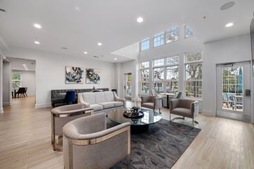Oakbrook Terrace apartment for rent - A modern living room with a glass table and grey chairs.