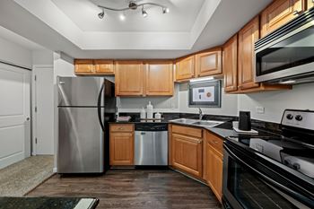 Gourmet kitchens with maple cabinetry & granite countertops
