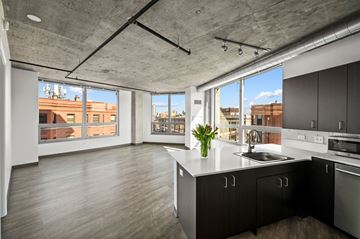 Chicago apartment for rent - a kitchen with a large window and a view of a city