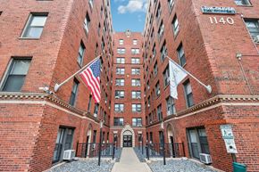 Chicago apartment for rent - A red brick building with the number 1140 on the top right corner.