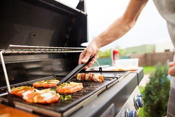 A man grilling food on a bbq