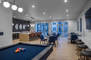 Wauwatosa apartment for rent - a communal area with a pool table and tables and chairs and a bar at 2929 on Mayfair, Wauwatosa, Wisconsin
