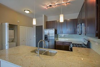 Contemporary espresso cabinetry with stainless-steel hardware pulls