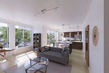 Evanston apartment for rent - A modern living room with a grey sofa and a glass coffee table.