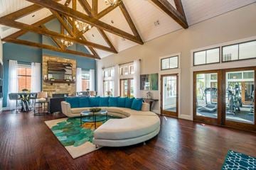 Fort Worth townhouse for rent - A living room with a white couch and a wooden floor.