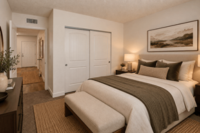 Las Vegas apartment for rent - Fifteen 50 Apartments bedroom staged with a large bed and a painting on the wall.