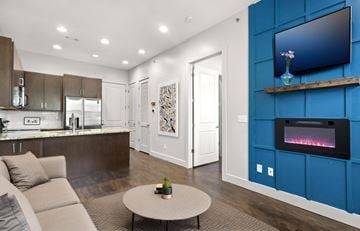 Nashville apartment for rent - A modern living room with a grey sofa and a coffee table.