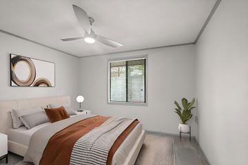 Hendersonville apartment for rent - A bedroom with a large bed and a dresser.