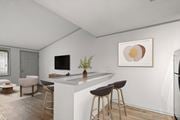 Hendersonville apartment for rent - Retreat at Indian Lake apartments in Hendersonville, TN modern kitchen with a bar area and a framed artwork on the wall.