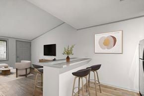 Hendersonville apartment for rent - Retreat at Indian Lake apartments in Hendersonville, TN modern kitchen with a bar area and a framed artwork on the wall.