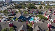 Orlando apartment for rent - A bird's eye view of Fusion Orlando Apartments and a swimming pool.