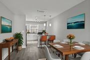 Jacksonville apartment for rent - A dining room with a wooden table set for four at Mandarin Bay Apartments.