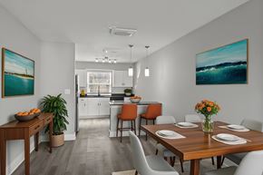 Jacksonville apartment for rent - A dining room with a wooden table set for four at Mandarin Bay Apartments.