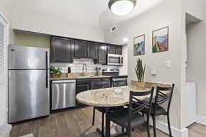Orlando apartment for rent - A kitchen with a table and chairs at Fusion Orlando Furnished Apartments.