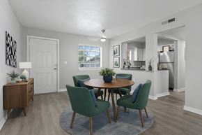 Lakeland apartment for rent - A dining room with a table and chairs at Watermarc Apartments.
