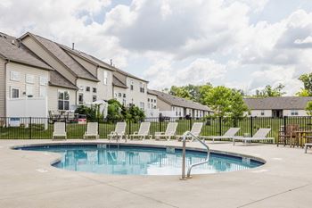 Sparkling pool with sundeck and grill