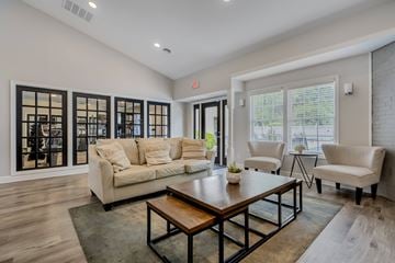 Reynoldsburg apartment for rent - A living room with a white couch and a coffee table.