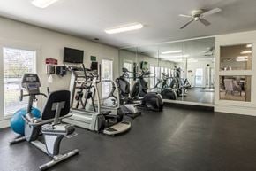 Dublin apartment for rent - 24-hour fitness center at Britton Woods Apartments in Dublin, Ohio, featuring free weights and cardio machines