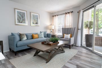 Dublin apartment for rent - a living room with a blue couch and a coffee table