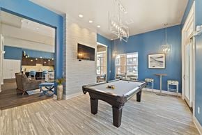 Miamisburg apartment for rent - The game room in the renovated clubhouse includes a pool table for resident recreation.