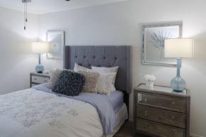 Florence apartment for rent - Stylish bedroom with plush carpet, ceiling fan, and vaulted ceiling in a one-bedroom apartment at The Boulevard