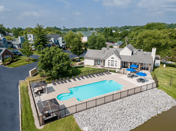 Sparkling pool with sundeck and grill area