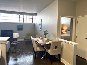 Philadelphia apartment for rent - A dining room with a table set for two and a potted plant.